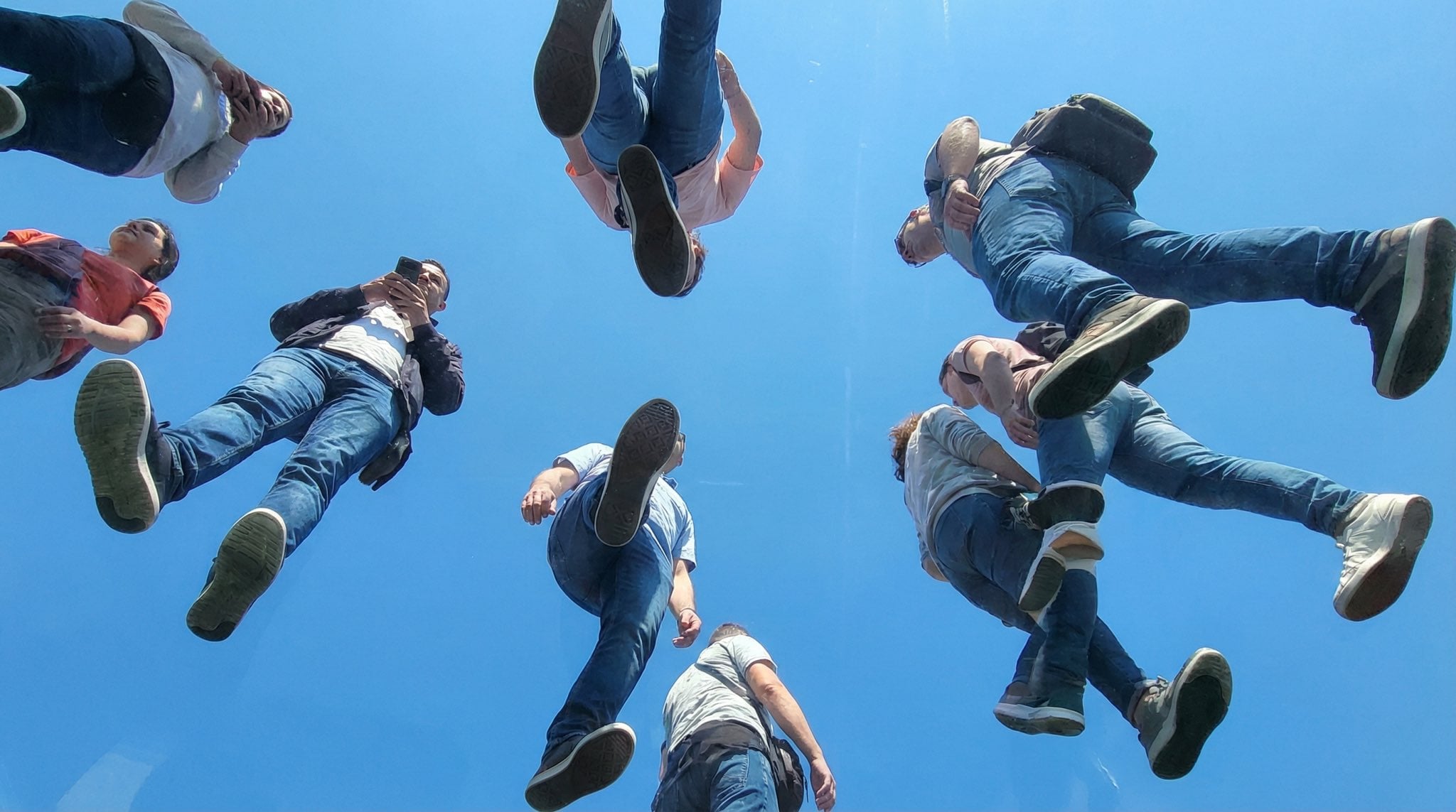 People Walking on Glass Seen from Below (4)