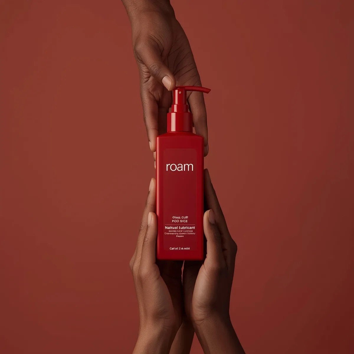 Red Pump Bottle Held by Many Hands (2)